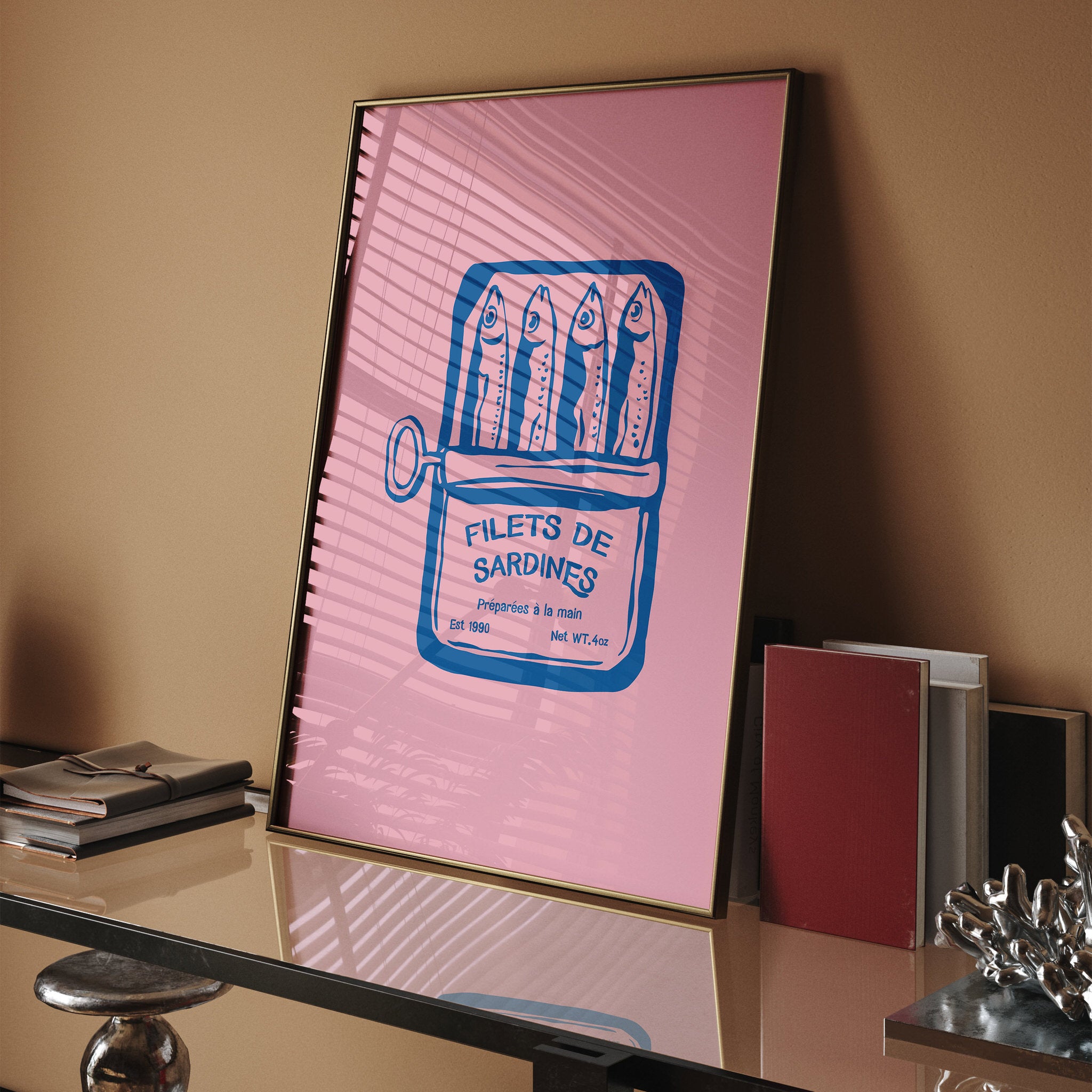 Whimsical wall art with a retro sardine can illustration in blue on pink background